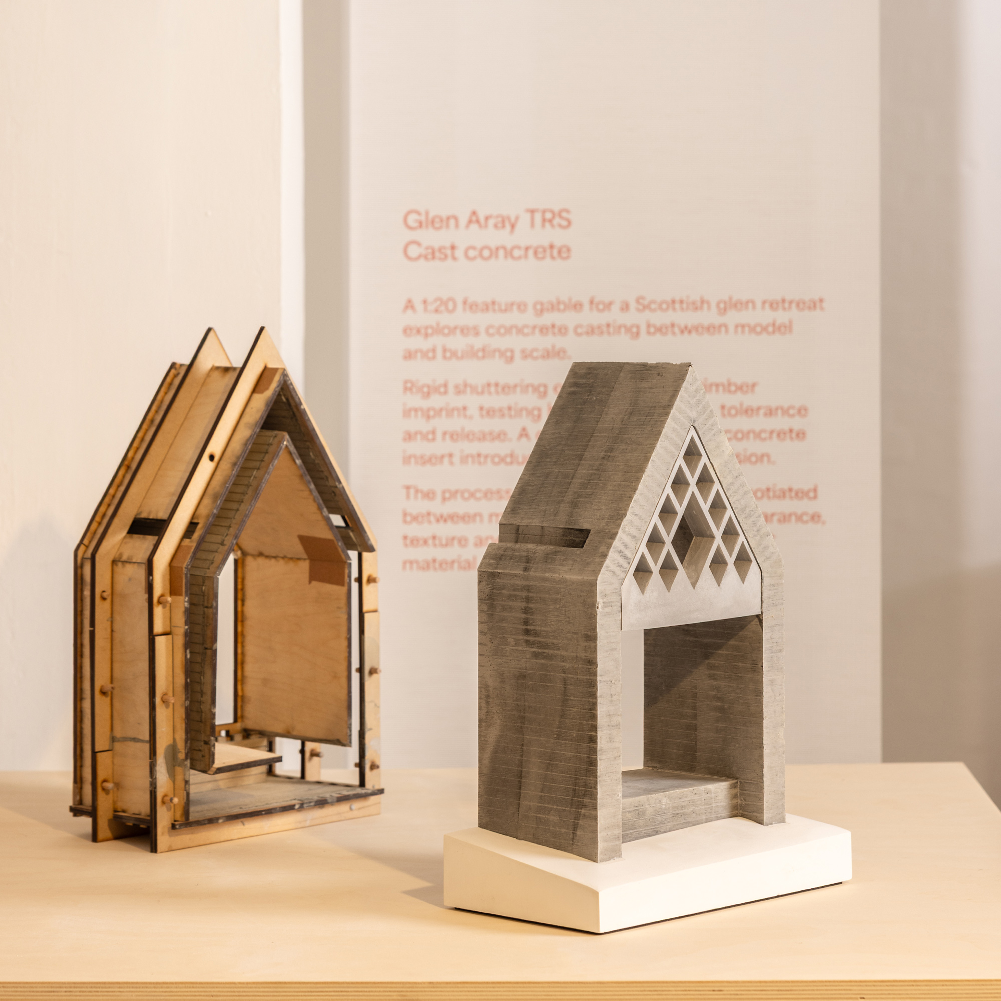 Photograph of a 1:20 cast concrete feature gable and laser-cut timber shuttering exhibited at the Aram Gallery, London, exploring concrete casting and material experimentation for the Glen Aray TRS retreat.